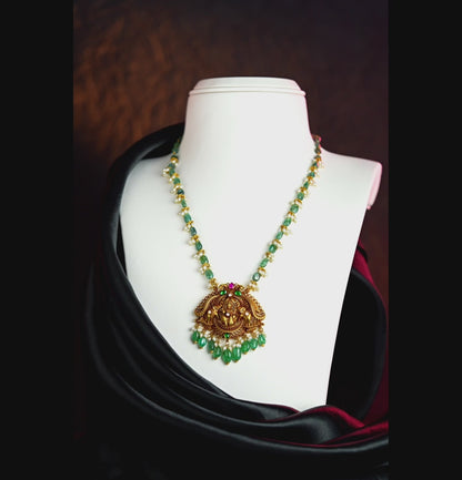 Resonant Laxmi Devi Emerald Gold Necklace
