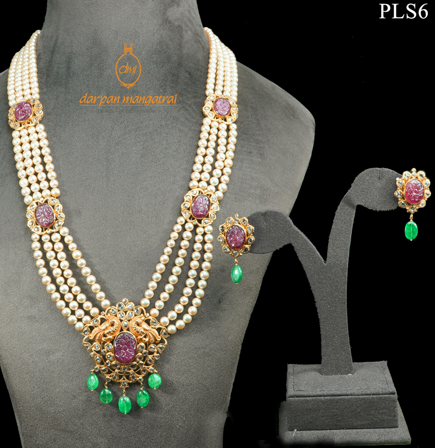 Skilfully Carved Ruby, Polki, Emerald and Pearl Gold Necklace and Earring Set