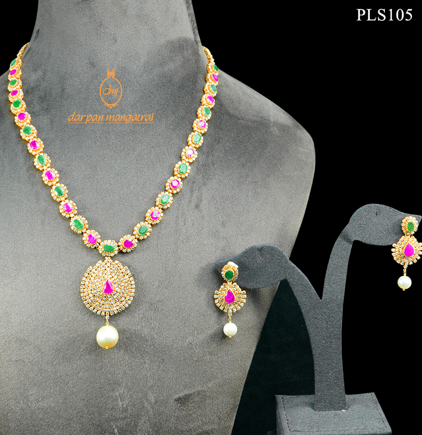 Scintillating Polki, Emerald, Ruby and Pearl Gold Necklace and Earring Set